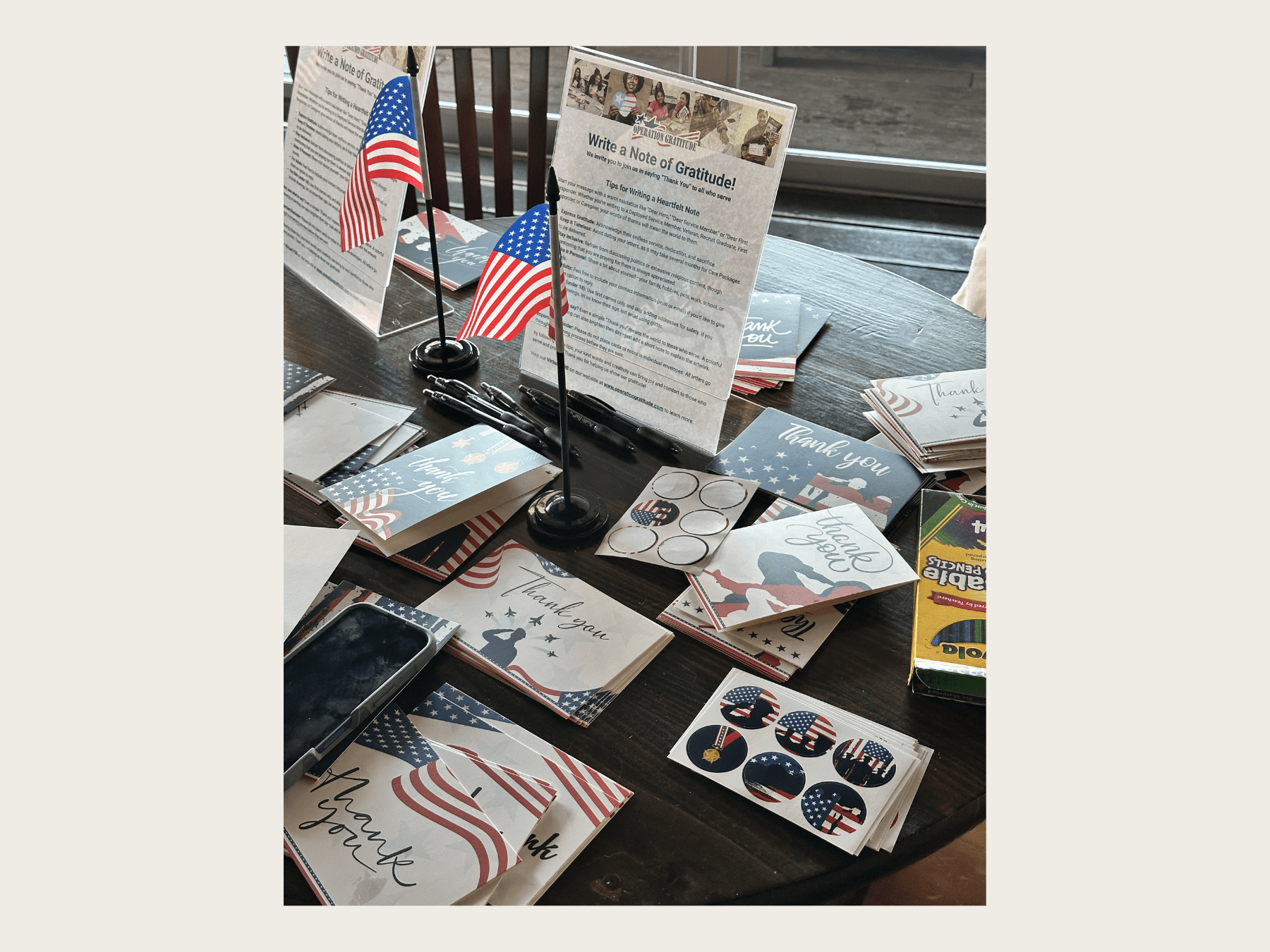Table setup with supplies to write notes of gratitude